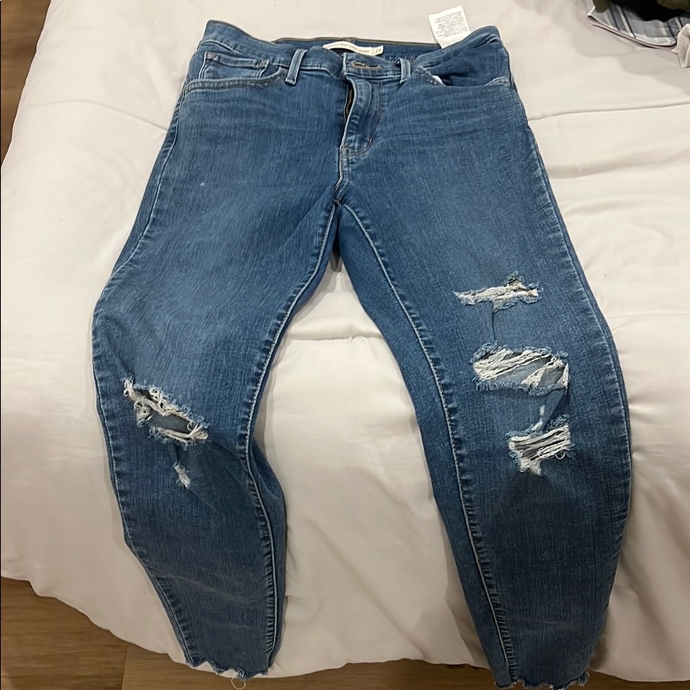 720 Levi’s high rise super skinny 
Women's Blue Distressed Jeans